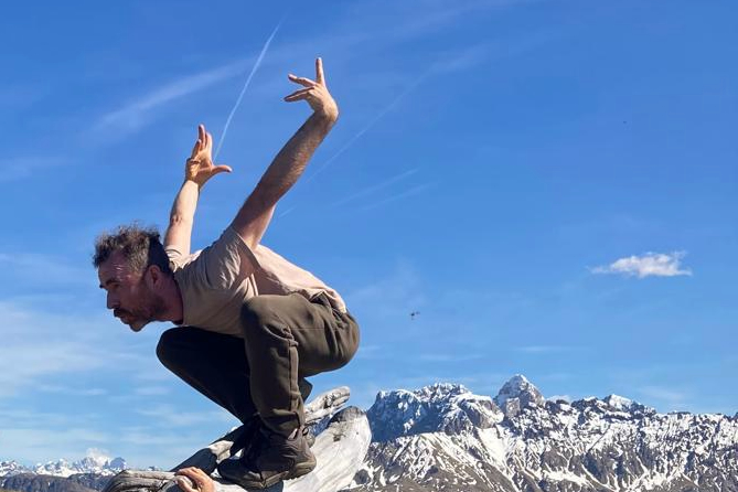 profile image of Aonghus Kneeshaw dancing on an old tree