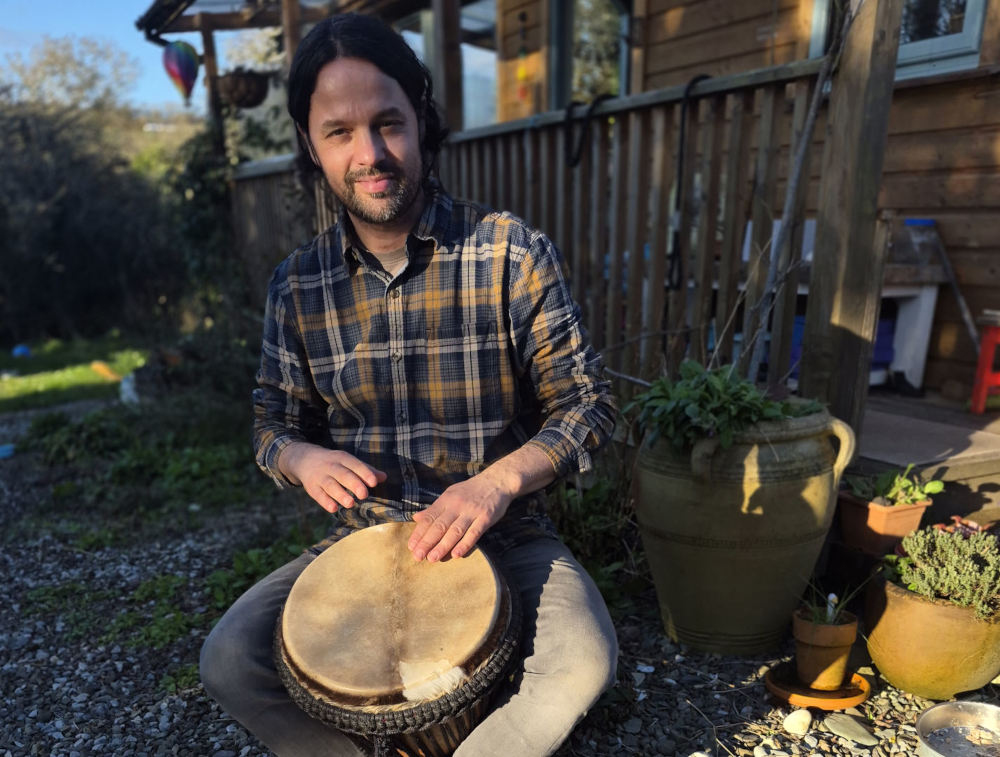 profile image of Fergal O'Connor sitting with drum