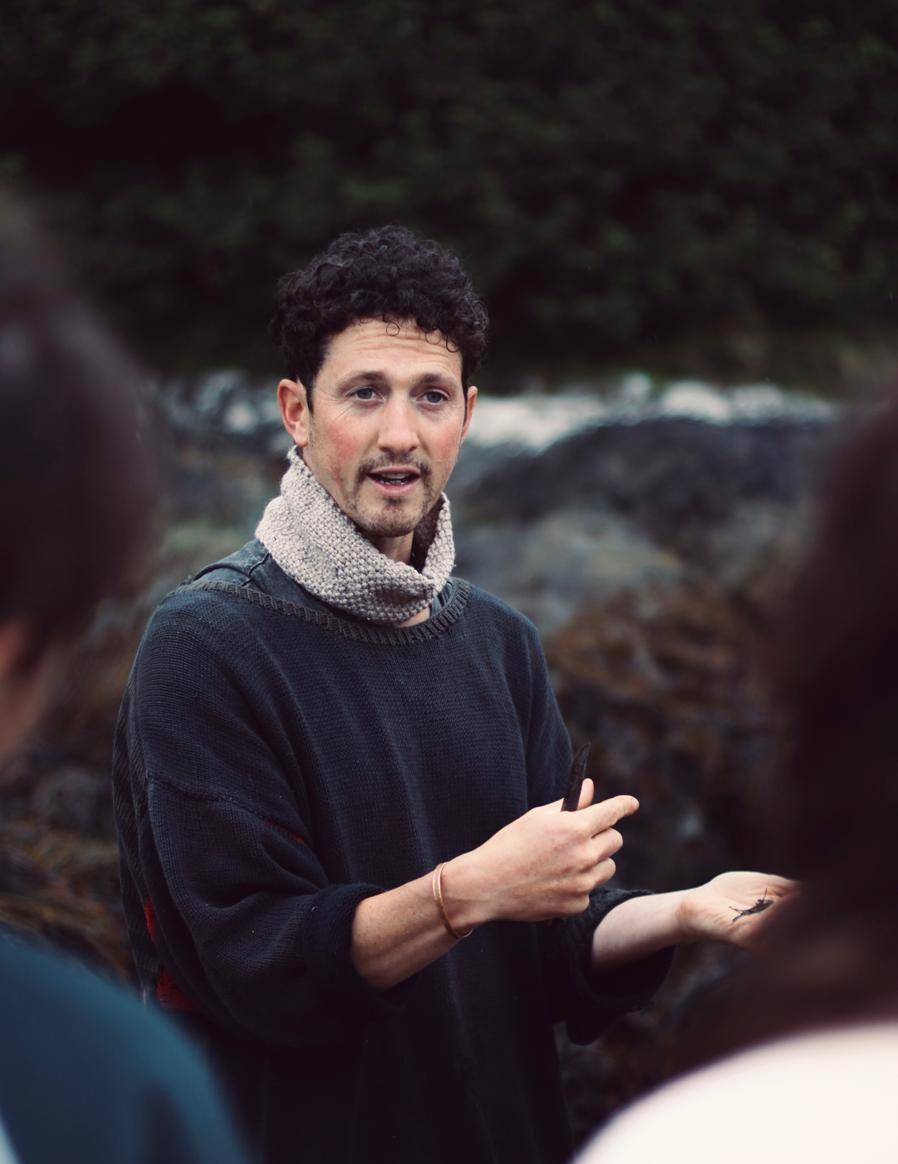 Samuel talking to people outdoors